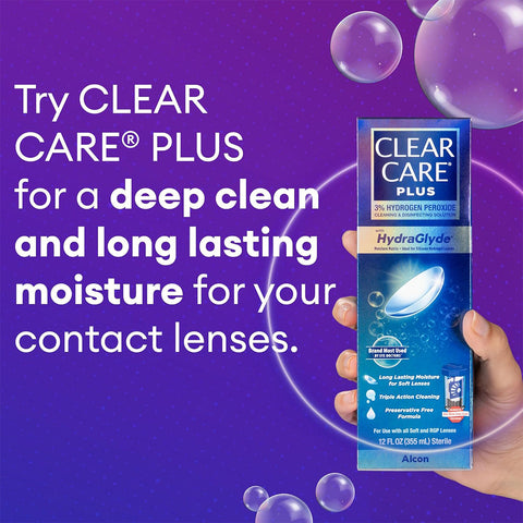 A hand holds a box of Alcons Clear Care Plus Cleaning Solution with Lens Case, 12 Oz Bottle. The purple background showcases bubbles and emphasizes the deep cleaning power of hydrogen peroxide and HydraGlyde® technology for lasting moisture.