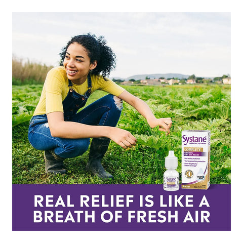 A smiling person with curly hair and overalls kneels in a field beside a box and bottle of Alcons Systane Complete Lubricant Eye Drops (10ml), featuring Nano-Droplet Technology. Text reads, Real relief is like a breath of fresh air.