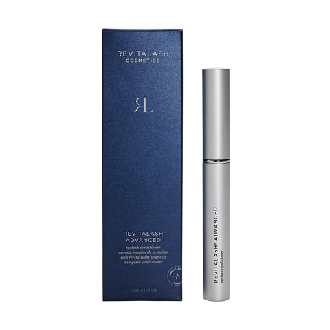 A silver tube of RevitaLash Advanced Eyelash Conditioner and Enhancing Serum sits beside its dark blue box, which displays the RevitaLash logo and product details, infused with BioPeptin Complex.