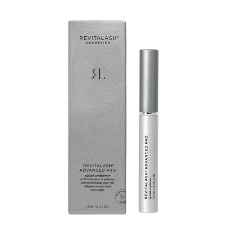 The RevitaLash Advanced PRO Eyelash Conditioner and Enhancing Serum (3.5mL, 6 Mo. Supply) in a silver box with matching tube, known for boosting lashes, is displayed. The packaging highlights product details while the tube promises relief for brittle lashes.