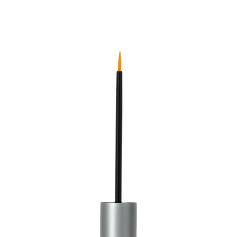 Close-up of an open RevitaLash Advanced PRO Eyelash Conditioner with a silver cap and thin black brush. The lash-enhancing serums orange-tipped applicator contrasts against the white background.