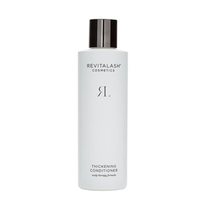 RevitaLashs Thickening Conditioner Scalp Therapy Formula, a 250mL white bottle with a black cap and minimalist design, offers hypoallergenic scalp therapy and nourishes hair.