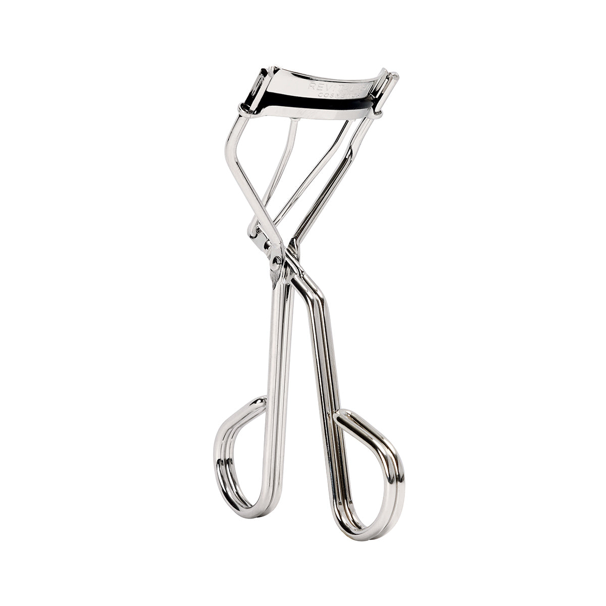 The RevitaLash Signature Eyelash Curler by RevitaLash is a silver carbon steel tool with a polished finish, ergonomic handles, and a curved clamp for effortless curling. It includes silicone lash curler pads and stands upright on a plain white background.