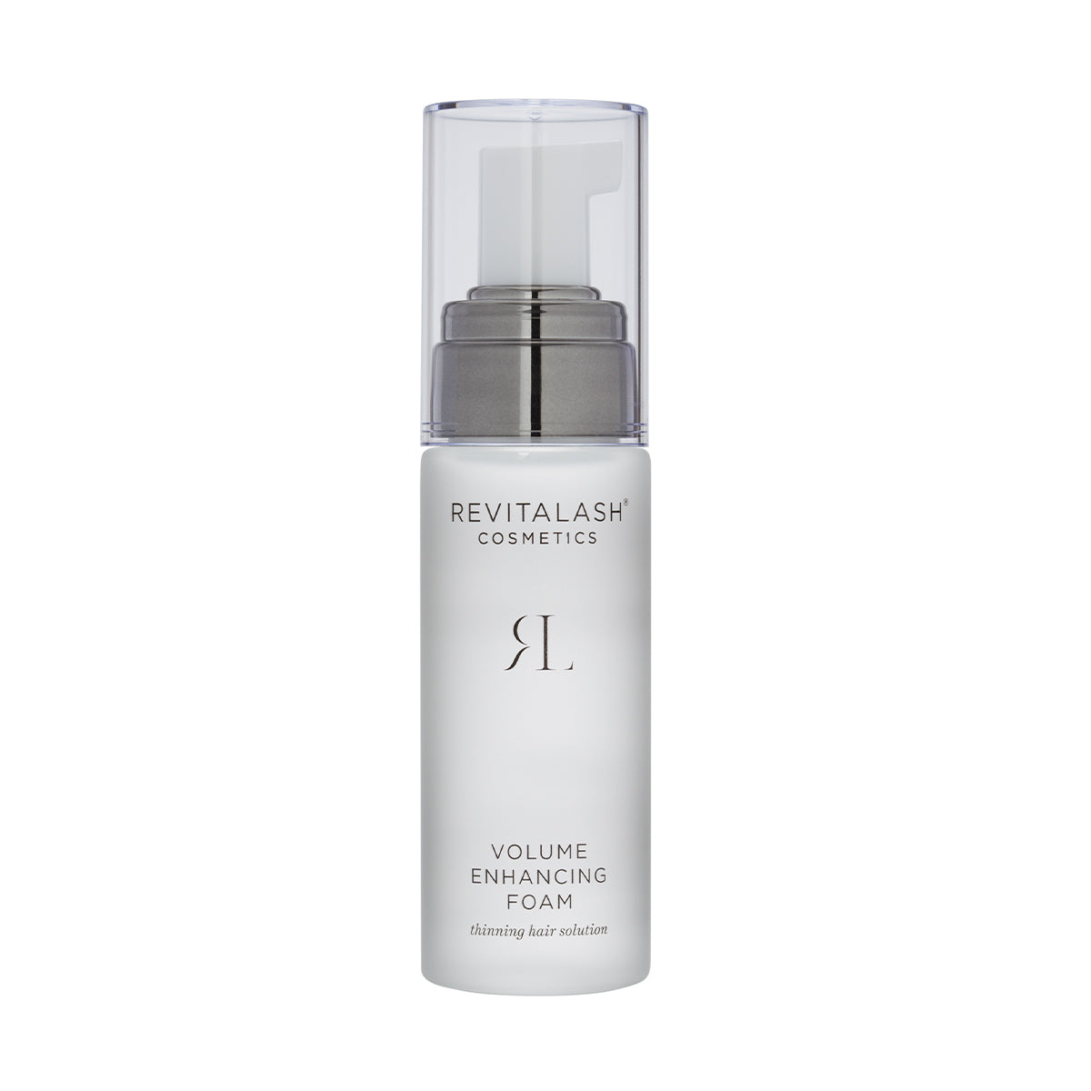 A cylindrical white bottle with a clear cap and silver pump, labeled RevitaLash Volume Enhancing Foam for Hair, features BioPeptin Complex for the ideal solution to thinning hair, ensuring voluminous locks.