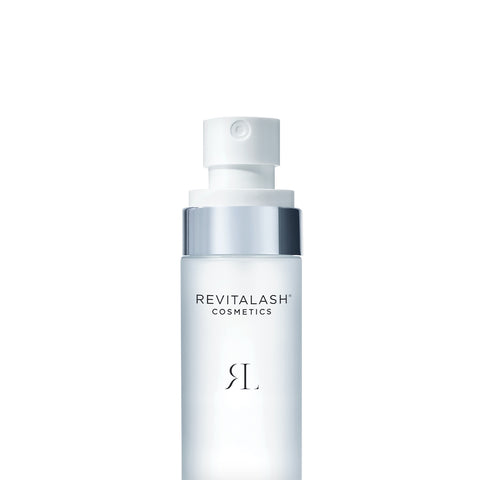 The RevitaLash Micellar Water Lash Wash comes in a frosted white cylindrical bottle with a silver cap, featuring the Revitalash Cosmetics label and prominent RL logo. This hypoallergenic makeup remover is formulated for sensitive eyes.