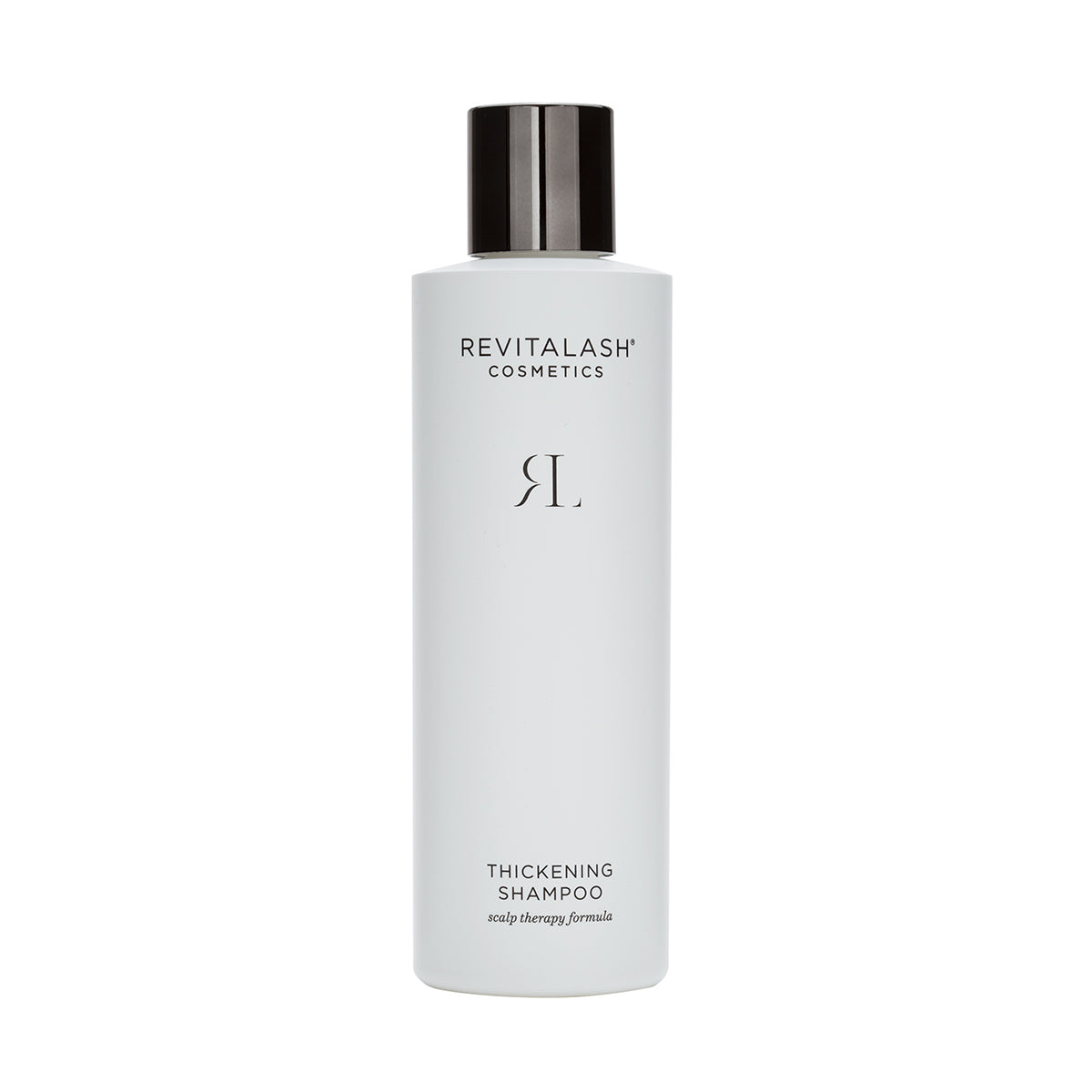 A white bottle of RevitaLash Thickening Shampoo with a black cap displays the brand name and promises increased hair volume and scalp therapy for revitalized hair.